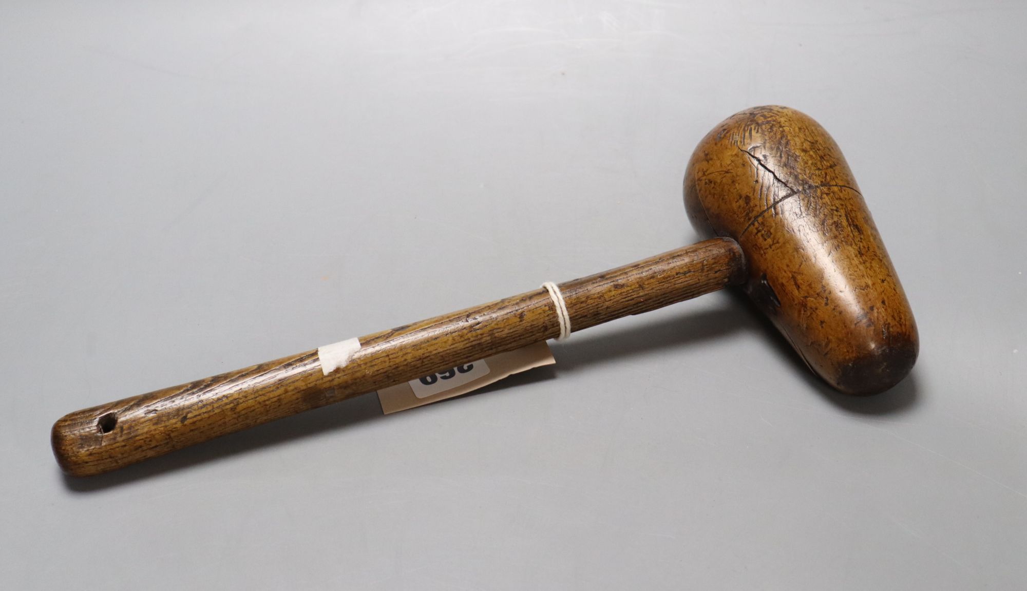 A Victorian lead workers bossing mallet, length 33cm